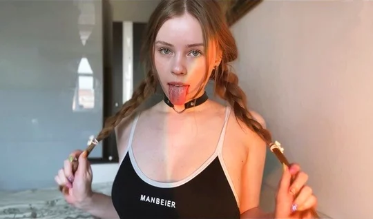 A young girl with pigtails with a sweet blowjob pleased her friend